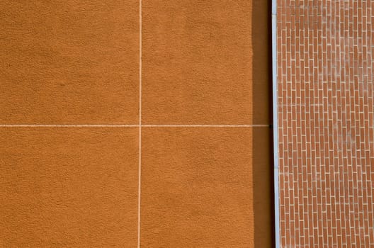 Modern building wall background. Construction details. Bricks and plaster.