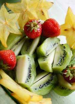 Healthy salad - mix of summer and exotic fruits         
    