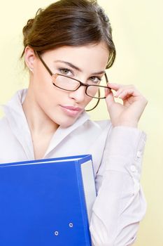 Pretty secretary with eyeglasses holding file