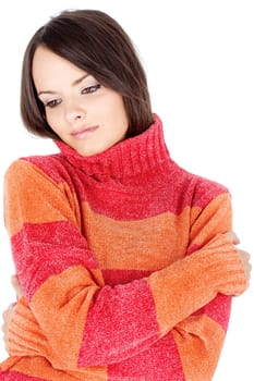 portrait of a young brunette in a red-orange wool sweater, isolated on white