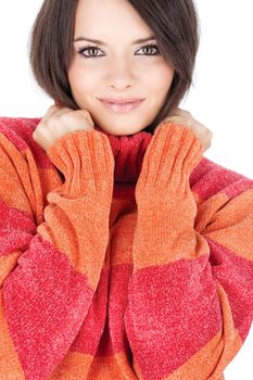 cute brunette woman in a red-orange wool sweater, isolated on white