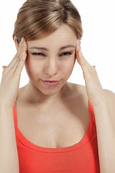young blonde woman suffering extreme headache on white background