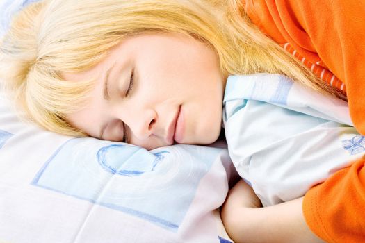 Blond girl sleeping, side close up look