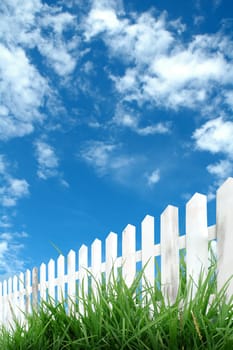 white fence with blue sky