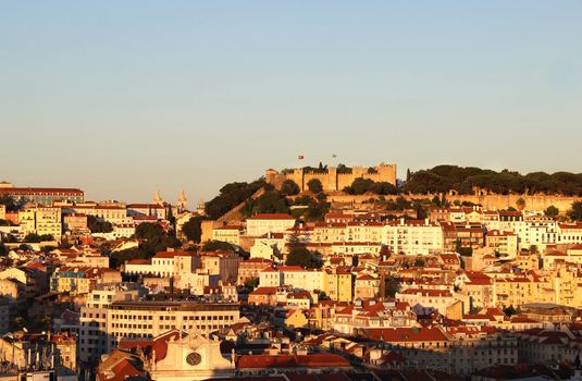 Sunset in Lisbon, Portugal �  panorama of buildings, roofs, churches