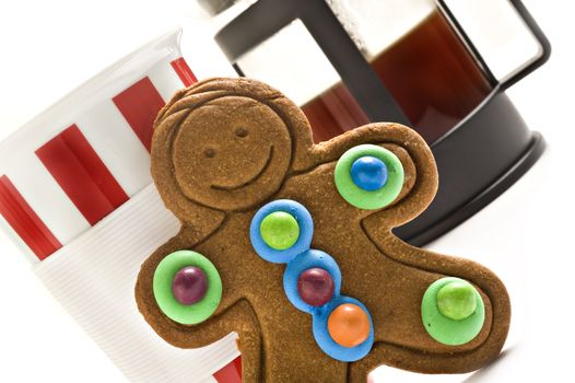 Colorful gingerbread man and coffee on white