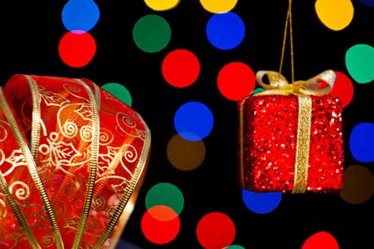 Red ribbon and gift with sereval colors light