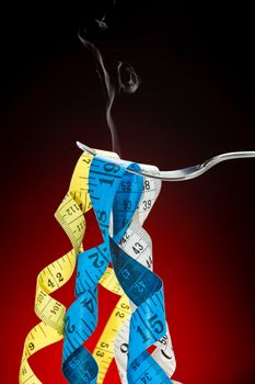 Tape measure pretending to fetuccini in a fork