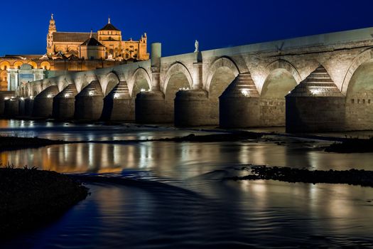 Cityscape of Cordoba at sunset with roman bridge and Mezquita, Andalusia, Spain
