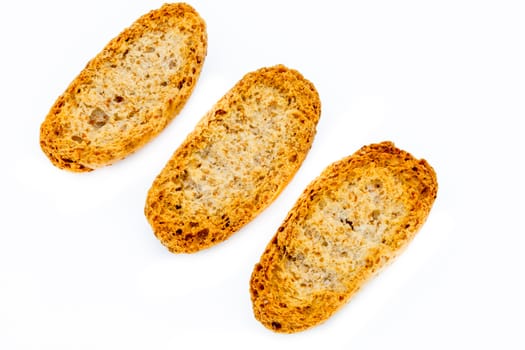 Three toasted bread on a white background