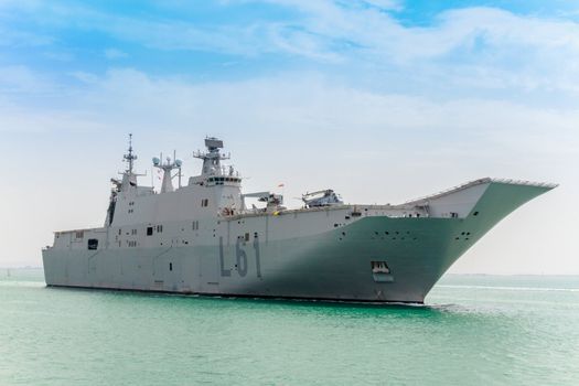 CADIZ, SPAIN-JUN 01: Aircraft carrier L-61 Juan Carlos I docking to take part in an exhibition on the day of the spanish army forces on Jun 01, 2012, in Cadiz, Spain