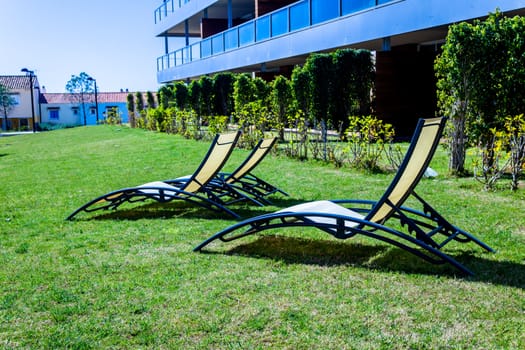 Several deckchairs near the swimming pool