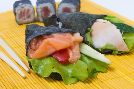 Various kinds of sushi and sashimi. Isolated.