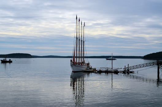 A ship at dock on a warm morning