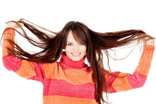 Pretty brunette woman holding her long hair, isolated on white background