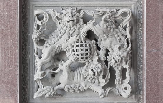 stone carving, dragon-headed unicorn