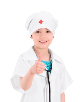 Portrait of a smiling little girl wearing as a doctor on white uniform, with a stethoscope, showing thumb up gesture. Isolated on white background.