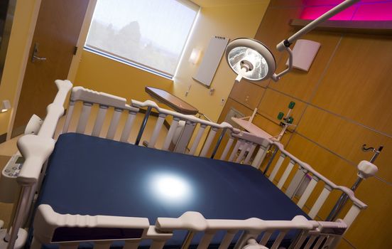 Medical Inspection Light Shines Down on Bed in Childrens Hospital Room