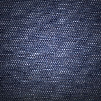 Texture of blue jeans textile close up
