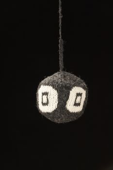 Knitted ball - on black background