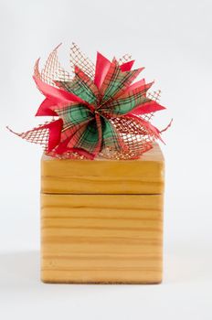 christmas bow and wooden box on white background