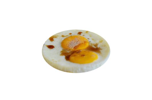  fried egg with tomato sauce on white background
