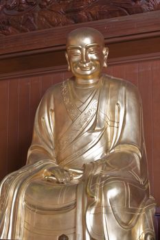 monk statue, Looking at the temple in Thailand.