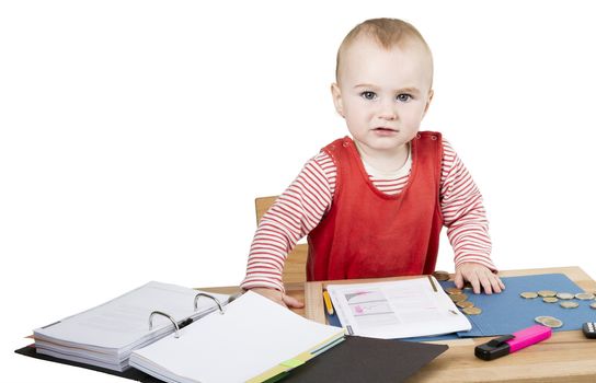 young child working at writing desk in light background