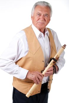 senior musician with native american flute and leather vest