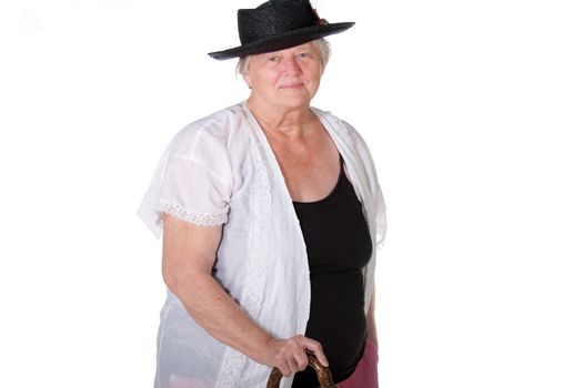 Senior woman with cane and hat smiling