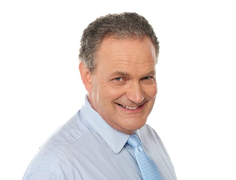 Closeup portrait of smiling senior male executive isolated over white background