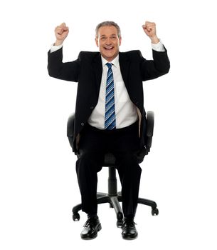 Successful business gesturing happiness, seated on chair. All on white background