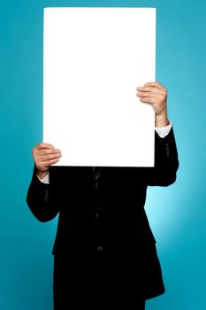 Manager hiding his face behind white banner ad isolated on gradient background