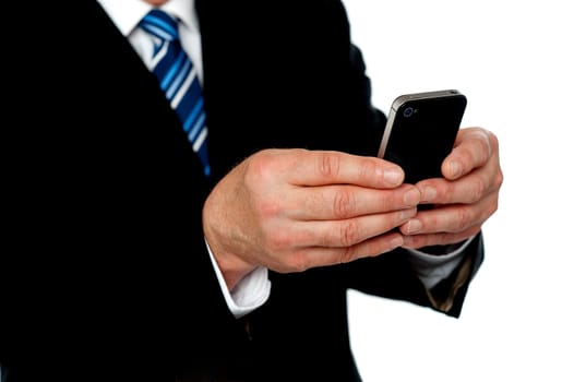 Cropped image of a man sending message from his phone, cropped image