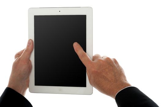 Finger of a man on tablet pc screen, closeup shot. Isolated over white