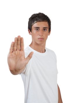 young swarthy man with brown eyes makes stop gesture/holds up hand