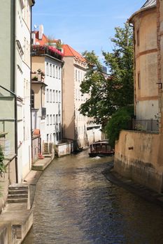 View of narrow canal between old houses named Chertovka River, Prague,Czech Republic