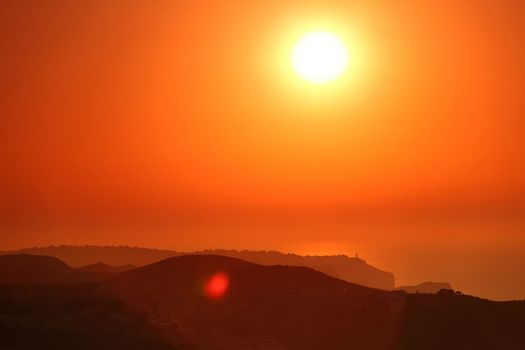 Summer landscape in mountains with the sun