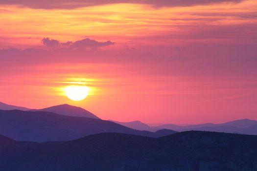 Summer landscape in mountains with the sun