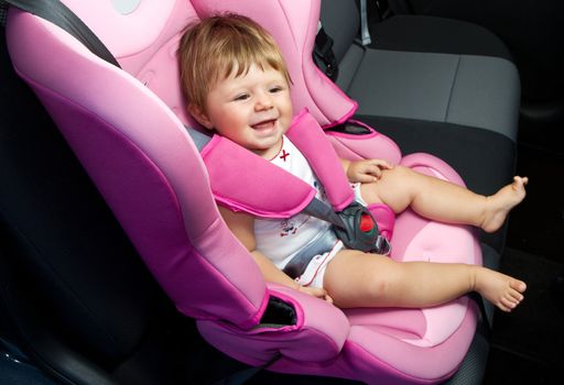 baby in a safety car seat. Safety and security 