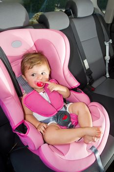 baby in a safety car seat. Safety and security 