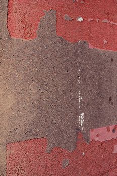 Fragment of asphalt road with red pointed pedestrian crossway.