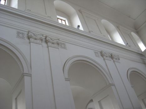 White wall of an architectural ensemble in Catholic church