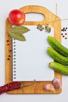 Notebook with recipes and shopping list in the kitchen