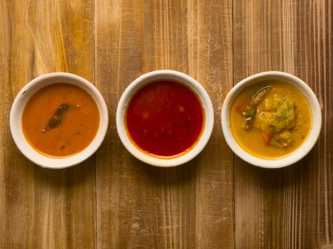 close up of bowls of indian curries