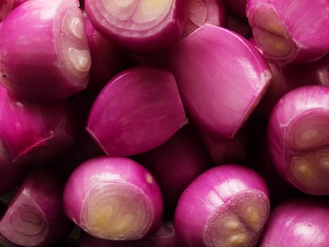 close up of peeled shallots food background