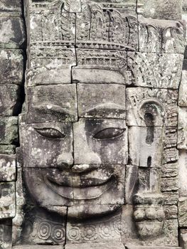 Eye contact with the famous smiling face at Bayon temple in Cambodia