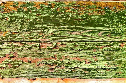 Grunge rural background - old painted wooden planks in sunlight.