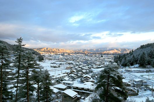 a winter japanese town during sunrise