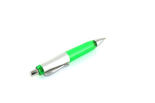 Green ball-point pen over white